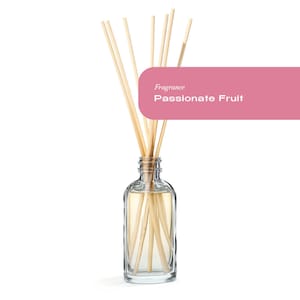 May include: A clear glass bottle with a diffuser stick set. The sticks are made of natural wood and are partially submerged in the liquid. The bottle has a label that reads "Fragrance Passionate Fruit".