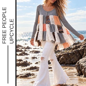 May include: A Free People Upcycle long-sleeve tunic featuring a grey knit bodice with a button-front neckline and a flared, multi-patterned patchwork skirt made of lace and floral fabric, paired with white distressed flare jeans in one size.
