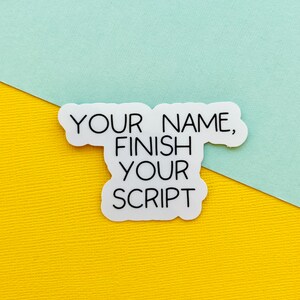 May include: White sticker with black text that reads "Your Name, Finish Your Script" on a yellow and light blue background.