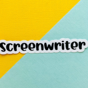 May include: A white sticker with the word "screenwriter" in black text on a blue and yellow background.