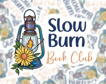 May include: A sticker with a blue lantern, a yellow sunflower, and the text "Slow Burn Book Club" in navy blue and orange.