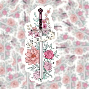 May include: A sticker featuring a silver sword with a pink handle, surrounded by pink and white flowers. The sword has a banner that reads "You Do Not Yield."