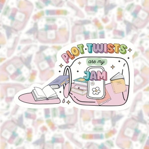 May include: A sticker with the phrase "PLOT TWISTS are my JAM" in colourful lettering. The design shows a jar overflowing with books, with "JAM" inside. The sticker has a white border and a background of similar, blurred designs.