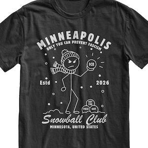 May include: Black t-shirt with a white graphic of a stick figure in a hat and scarf holding an ice ball. Text includes "MINNEAPOLIS," "Snowball Club," and "ONLY YOU CAN PREVENT FASCISM."