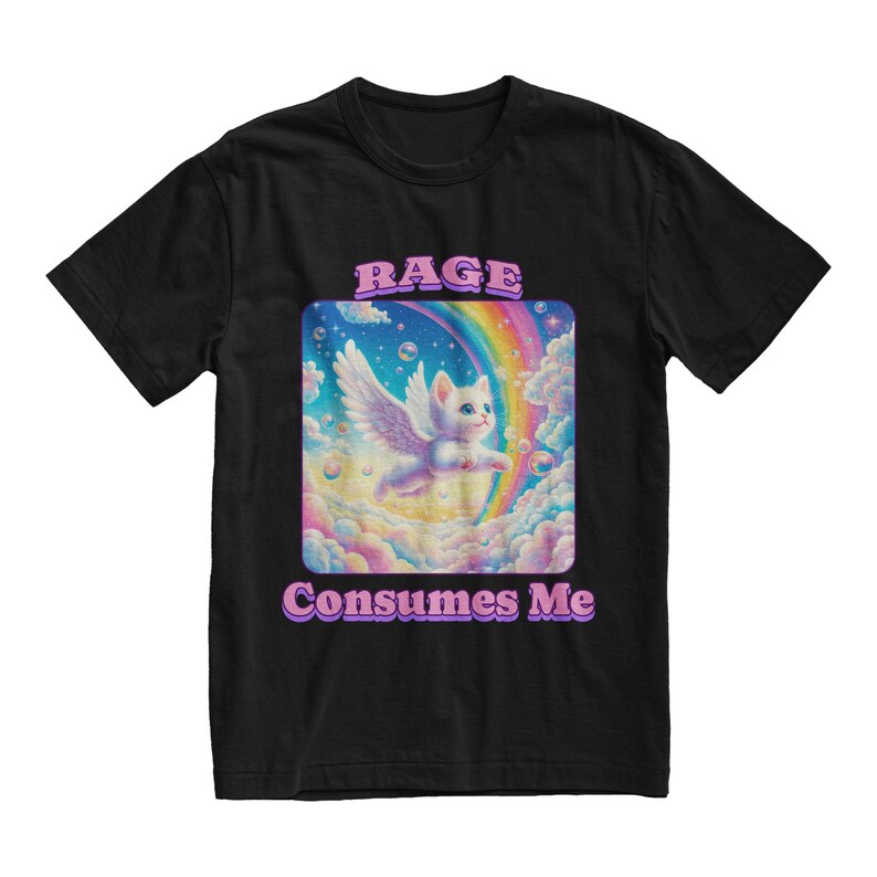 May include: Black t-shirt with a graphic of a white cat with wings flying through a rainbow in a cloud-filled sky. The text "RAGE CONSUMES ME" is printed below the graphic.