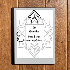 May include: A digital e-ink device displaying a mandala coloring book cover. The cover features a large, detailed mandala design in gray and black, with the text "50 Mandalas trace & color on e-ink devices" in a square in the center.