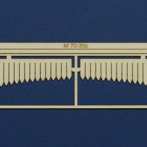 May include: A wooden model kit for a fence with a curved top. The kit is labelled "M 70-35c".