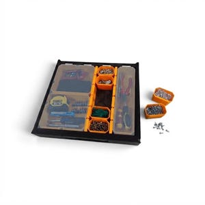 May include: A black tool organizer tray featuring multiple orange removable bins and clear plastic compartments. The tray contains various hand tools, a yellow DeWalt tape measure, drill bits, screws, and fasteners organized in separate sections.