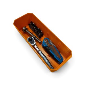 May include: A bright orange rectangular storage tray containing a silver metal ratchet, a black and blue folding utility knife, and a black plastic holder filled with various small metal screwdriver bits arranged in a single row.