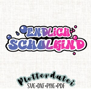 May include: A colorful graphic design with the text "ENDLICH SCHULKIND" in bubble letters with a pink and blue gradient. The text is outlined in black and surrounded by small white circles.