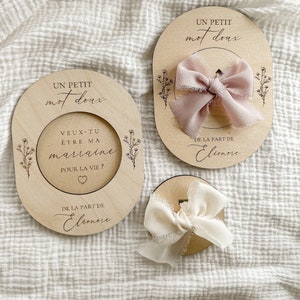 Announcement requesting a surprise godmother or godfather in engraved wood