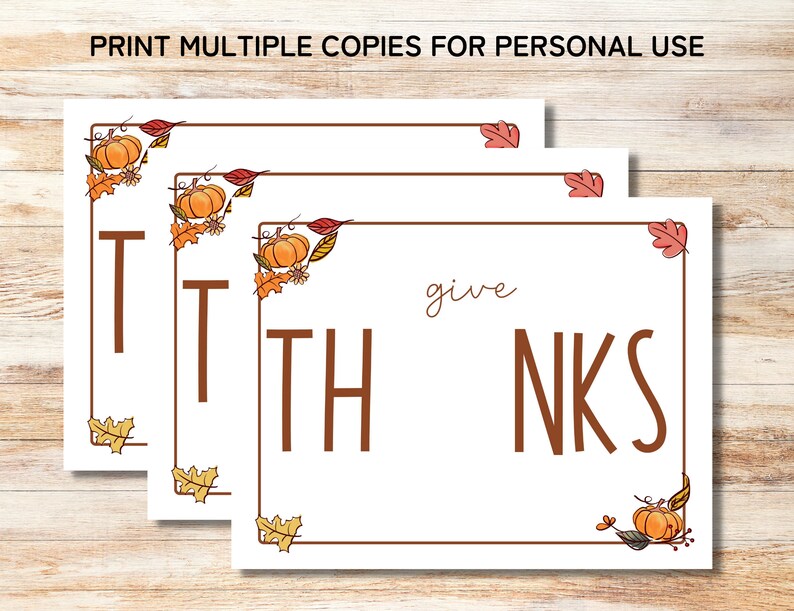 May include: Three printable cards with an autumn theme. Each card has a brown border with orange and red leaves and pumpkins. The text on the cards reads "give thanks".