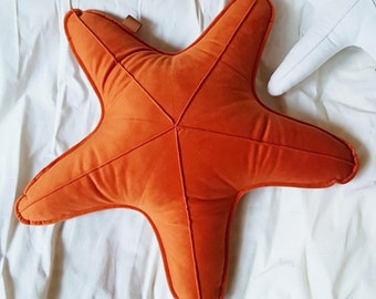 Decorative velvet orange starfish cushion, sea star shaped pillow in the ocean baby room, seaside home decor gift idea for the beach house