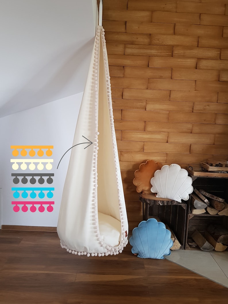 boho room hanging egg chair with pompoms for kids
