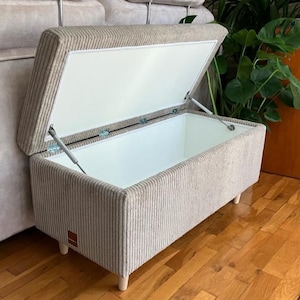 lobby bench with a storage box in the vintage style made of corduroy fabric for the living room in the german style