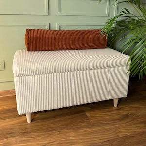 corduroy bench with a storage chest box in ecru with a corduroy bolster pillow on top