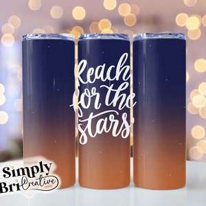 May include: Three stainless steel tumblers with a gradient design of blue to orange. The middle tumbler has the text "Reach for the stars" in white cursive lettering.