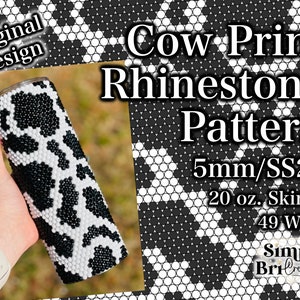 May include: A skinny 20 oz. tumbler with a cow print rhinestone pattern. The design features black and white rhinestones arranged in a cowhide pattern. The text "Original Design" is visible.
