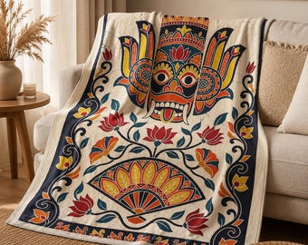 Coperta in peluche con maschera Raksha dello Sri Lanka, ispirata all'arte popolare dello Sri Lanka.
