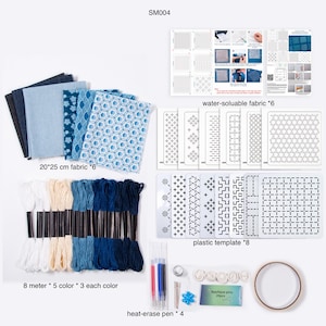 May include: A crafting kit labeled SM004 containing six 20x25 cm fabric pieces in blue shades, eight plastic templates, six water-soluble fabric sheets, fifteen embroidery floss skeins in five colors, four heat-erase pens, pins, and tape.