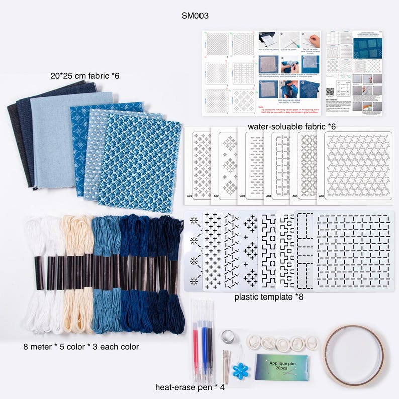 May include: A craft kit labeled SM003 containing six 20x25 cm fabric pieces in blue shades, six water-soluble fabric sheets, eight plastic templates, fifteen 8-meter embroidery floss skeins in five colors, four heat-erase pens, pins, and tape.