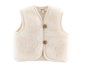 May include: A cream-colored fleece vest with a V-neck and wooden button closures. The vest is made of a soft, warm material and is perfect for layering in the colder months.