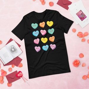 May include: Black t-shirt with a graphic of colorful conversation hearts with words like "Xanax", "Benadryl", "Prozac", and "Valium".