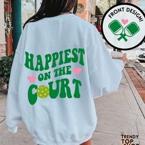 Pickleball sweatshirt happiest on the court cute pickleball shirt pickle ball sweatshirt pickleball gifts pickle ball shirt pickleball lover