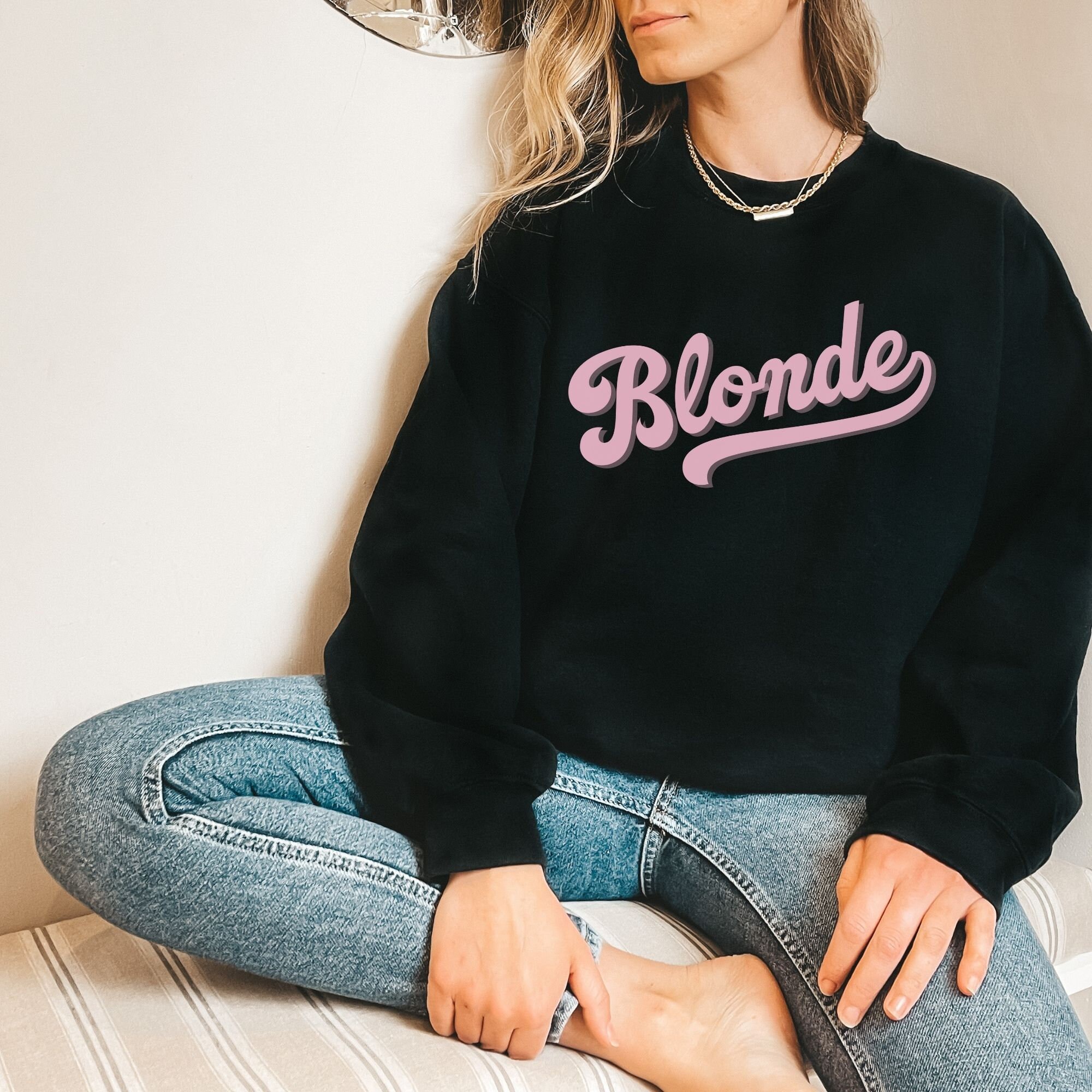Blonde sweatshirt pink top