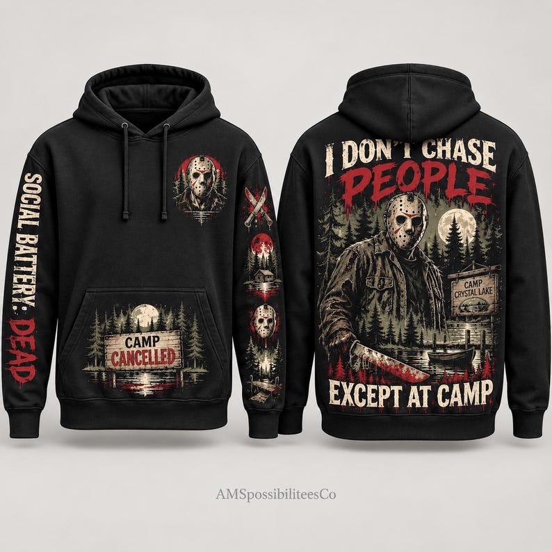 May include: A black hooded sweatshirt featuring a graphic of a hockey-masked figure holding a machete. The back displays the text I DON'T CHASE PEOPLE EXCEPT AT CAMP. The front and sleeves include a Camp Crystal Lake sign, forest scenery, and the text SOCIAL BATTERY: DEAD.