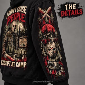 May include: A black hoodie featuring a graphic print of a masked figure holding a knife with the text I DON'T CHASE PEOPLE EXCEPT AT CAMP and CAMP CRYSTAL LAKE. The sleeve displays crossed machetes, a cabin, a hockey mask, and a lake scene.