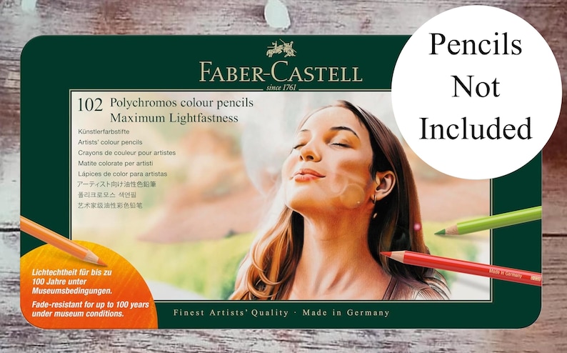 May include: A dark green box of Faber-Castell Polychromos color pencils. The box features an image of a woman with long brown hair. Text on the box includes "102 Polychromos colour pencils" and "Maximum Lightfastness". The text "Pencils Not Included" is also present.