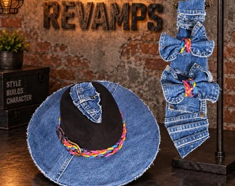 May include: A black hat with a wide blue denim brim and a braided multi-colored band with a brass buckle, accompanied by a hanging denim necktie featuring two denim bows with braided multi-colored centers and frayed edges.