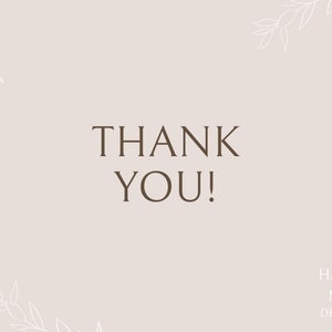 May include: A simple thank you card with a light brown background and white floral accents. The text "THANK YOU!" is in brown text. The bottom of the card has the text "HAYLIE MAE DESIGNS" in brown text.
