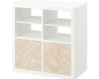 May include: White cube storage shelf with two drawers. The drawers have a beige and white geometric pattern.