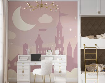 May include: A pink and white children's room with a mural of a castle and a crescent moon. The room features a white desk with a white chair, a white bunk bed with a brown headboard, and a gold chandelier.