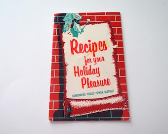 May include: Vintage holiday recipe booklet with a red brick border. The cover reads "Recipes for your Holiday Pleasure" in red script. Features holly and berry accents. The Consumers Public Power District is printed at the bottom.