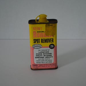May include: A vintage yellow and pink spot remover tin with a yellow cap. The label reads "Rent Spot Remover" and lists stain removal capabilities. The tin is marked "NEW!" and "29¢".
