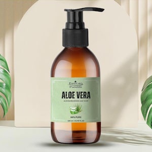 May include: A brown glass bottle with a pump dispenser containing 99% pure aloe vera juice. The label is green and white with the text "Essican Purelife Aloe Vera Aloe Barbadensis Leaf Juice 99% Pure 250 ml e 8.45 fl oz".