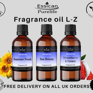 May include: Three brown glass bottles with black caps and white labels. The labels say "Essican Purelife Premium" and list the fragrance oil scents: "Summer Fresh", "Sea Breeze", and "Strawberry & Cream".