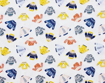 May include: A white fabric featuring a repeating pattern of various sweaters in shades of red, yellow, blue, and grey. The sweaters display diverse designs including polka dots, stripes, and winter-themed motifs like trees and reindeer.
