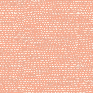 May include: A peach-colored background with a repeating pattern of small white dots.