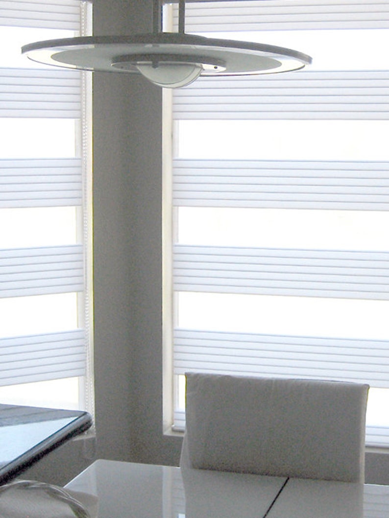 Combi Shades, Twin Wide uses a 3.75 inch tall “mesh” type sheer and a 5.5 inch tall horizontal pleated semi-opaque fabric in a wide range of colour choices.. Provide view-through and visual privacy. Shades block up to 99% of UV rays when closed.