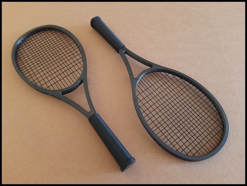 May include: A set of three ceramic mugs with a speckled, cream-colored glaze. Each mug features a different hand-painted floral design in shades of blue, green, and yellow. The mugs have a simple, rounded shape and a comfortable handle.