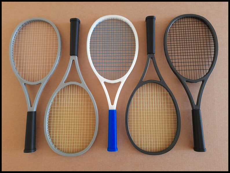 May include: A set of three ceramic mugs with a speckled, matte finish. The mugs are in shades of cream, light gray, and dark gray. Each mug has a simple, minimalist design and a rounded handle.