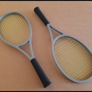 May include: A set of three ceramic mugs with a speckled, matte finish. The mugs are in shades of cream, light gray, and dark gray. Each mug has a simple, minimalist design, perfect for coffee or tea.