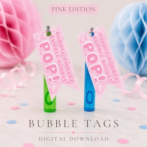 May include: Pink bubble tags with the text "POP!" and "Bubble Bubble" on a white surface. The tags are attached to green and blue bubble wands. The words "Bubble Tags" and "Digital Download" are also visible.