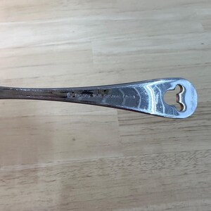 May include: A handmade wooden sign with the text "Welcome" in a playful font. The sign features a distressed white background and a dark brown frame, perfect for a front door or entryway. The sign measures approximately 12 inches wide and 6 inches tall.