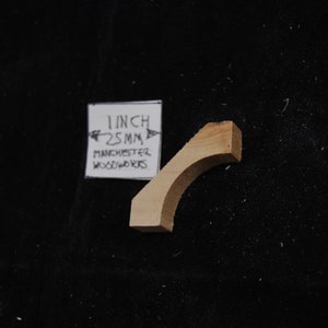 May include: A 1 inch (25 mm) wooden arch, made by Manchester Woodworks.