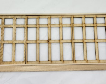 May include: A wooden lattice panel with a grid pattern, consisting of three sections. The panel is made of light brown wood and has a natural finish.